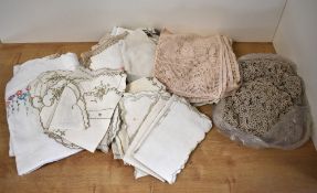 A quantity of cotton, crochet and embroidered fabrics and homelinens in white, beige, taupe and