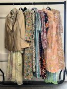 A collection of of 20th century vintage dresses, mostly floral, various colours and fabrics to