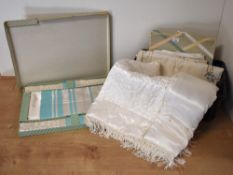 Assorted cream jaquard, damask and satin home linens.
