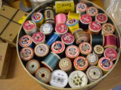 A large quantity of assorted sewing machine cotton and other thread bobbins, dating back to the