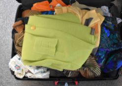 Assorted 1990-2000s womens wear to include y2k jackets, patterned shirts, knee length skirts in