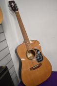 An Encore W255 acoustic guitar