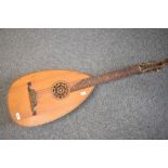 A traditional guitar style 6 string lute, having bowl back, overall length approx. 97cm