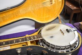 A vintage Antoria 'lawsuit' style five string banjo , in the Gibson Mastertone style, sold with