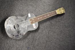 An Ashbury resonator ukulele , with padded case