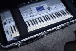 A Yamaha PSR S500 keyboard, in fitted flight case