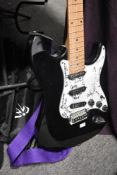 A Benson electric guitar , stratocaster shape , bearing various signatures to scratch plate,