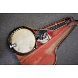 An early 20th Century John Grey & Sons, London Five String banjo having unusual Indian brass style