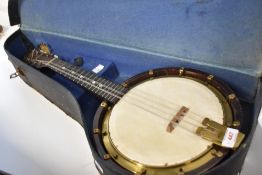 An early 20th Century Bell-Tone mandolin banjo (banjolin) numbered 342874, sold with shaped case