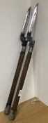 WW2-period Entrenching Tool Helves with metal fittings at each end, one stamped M.U.R. 1945 with