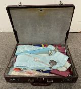 Masonic interest, a brown leather suitcase 10cm x 45cm x 34cm containing a quantity of Masonic