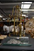 A large 20th-century brass hall lantern chandelier, featuring a multi light fixture, crystal cut
