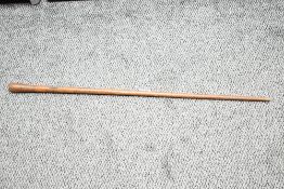 A small late 19th to early 20th-century Folk Art-style wooden walking stick, having a hand carved