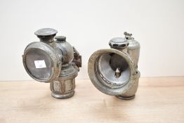 Two late 19th to early 20th-century Joseph Lucas of Birmingham metal carbide bicycle lamps, to