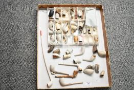 A large selection of 18th and 19th-century clay pipes, to feature a selection of varying bowl