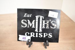 A small early 20th-century Art Deco Smith's Potatoe Crisps bakelite advertising sign, 12.5cm x 10cm,