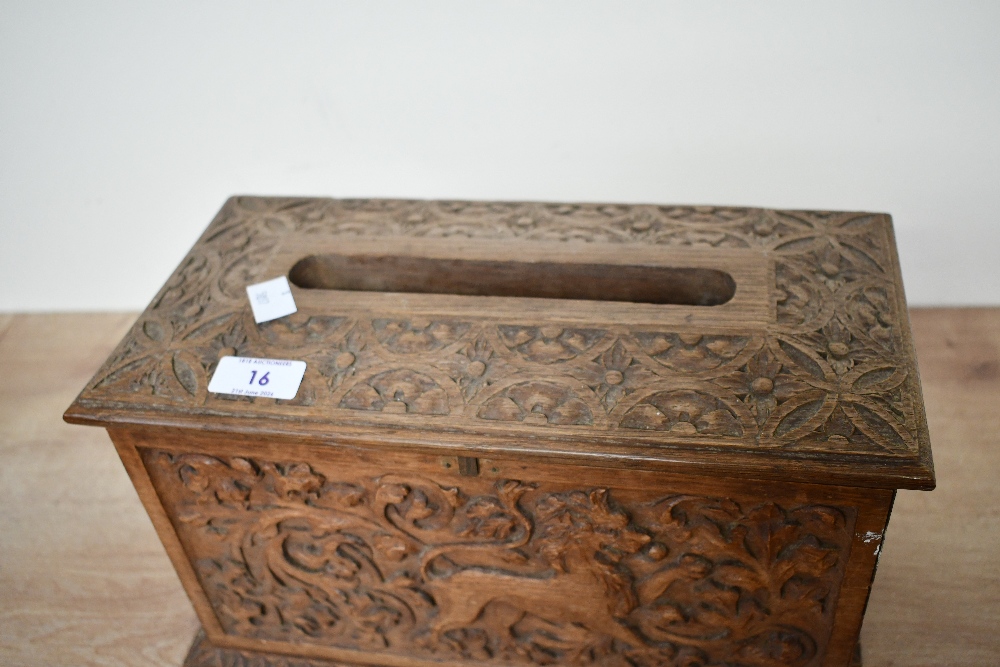 A small 20th-century carved wooden tissue box holder, in the form of a chest, featuring detailed - Image 2 of 5