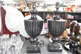 Two late 20th-century Laura Ashley 'Meredith' ceramic lamp bases, of black urn-form, no shades,
