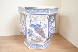 A contemporary Japanese Panda Pottery jardinière, of hexagonal form, featuring blue and white