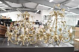 Two large 20th-century French-style toleware chandeliers, decorated with delicate metal leaves and