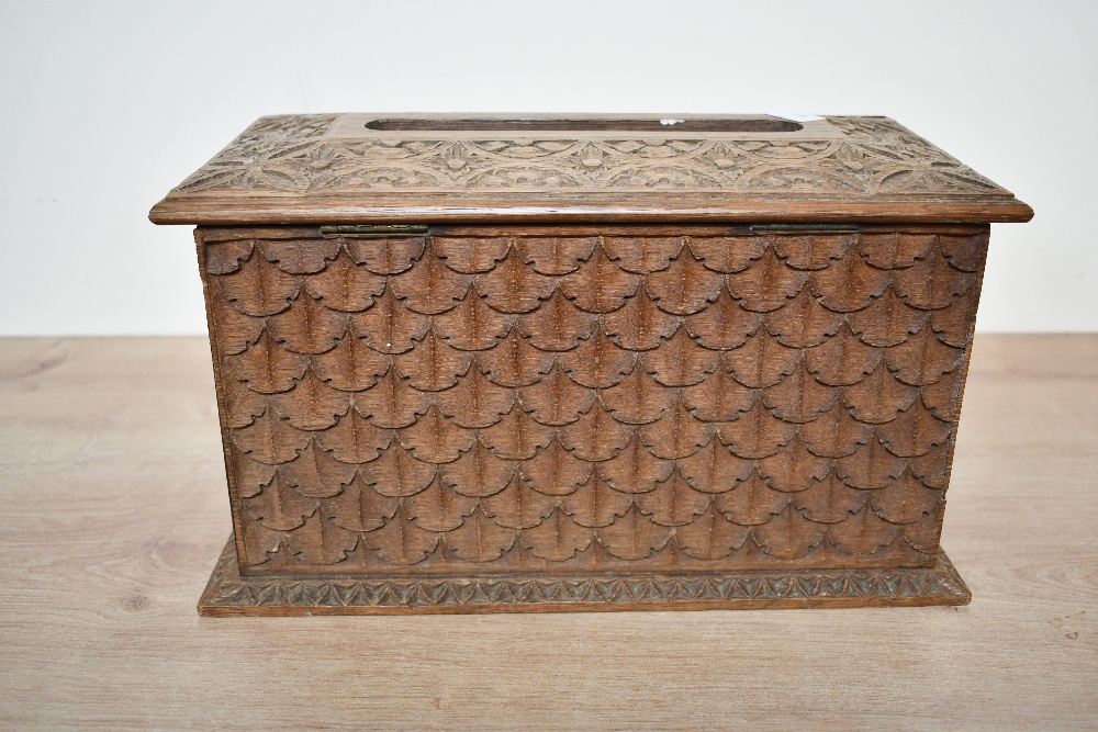 A small 20th-century carved wooden tissue box holder, in the form of a chest, featuring detailed - Image 3 of 5