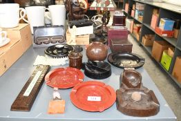 A selection of early to mid 20th-century bakelite ashtrays and related ephemera, to feature two