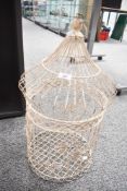 A large vintage metal birdcage, having been painted white with palm tree decoration, unmarked,