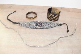 Of ethnographic interest, two pieces of 20th-century Papua New Guinea tribal shell adornment, to