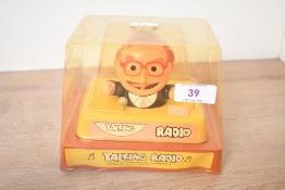 A vintage 'Talking Radio' novelty toy, in original box, sold as seen.