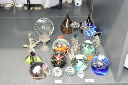 A quantity of 20th-century art glass paperweights, to feature a blue glass teapot example, a