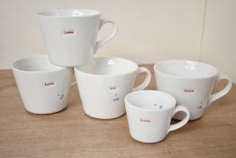 Five 20th-century Keith Brymer Jones 'Word' porcelain mugs, to feature three large 'love', one 1/4
