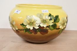 A Victorian Burmantofts Faience of Leeds barbotine jardinière, featuring hand-applied floral