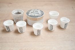 A Victorian iron stone advertising pot for 'cold cream', featuring a monochrome gothic-style