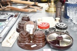 A quantity of early to mid 20th-century bakelite desk wares, to feature a revolving paperclip