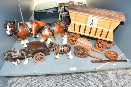 A group of four mid 20th century Melba Ware-style Shire horses and wooden cart figurines featuring