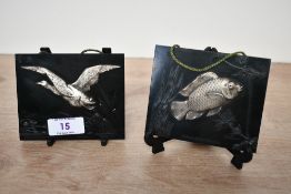 Two early 20th-century La Gerbe d'Or of Paris (1900-1939) black bakelite calendar holders, to