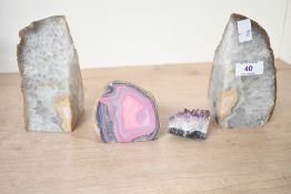 Two polished agate geode slice bookends; sold with a small chunk of amethyst and a polished pink