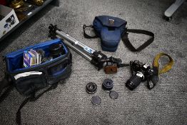 A Nikon F-301 camera with a Series E 75-150mm 1:3,5 lens, Nikkor 50mm 1:1,8 lens a Tamron 1,2,5 28mm