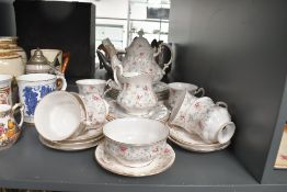 A 20th-century Paragon china 'First Choice' tea set, featuring delicate floral detailing with gilt