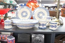 A quantity of contemporary Brixton Pottery, to feature a repetitive blue floral and foliate