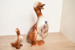 Two vintage ceramic duck figurines, featuring game bird decoration, marked to base, 13.5cm and