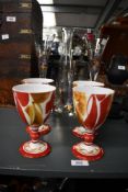 Four vintage Aldermaston Pottery lustre goblets after Alan Caiger-Smith, featuring red and yellow