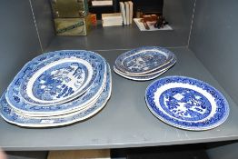 A quantity of late 18th to 19th-century 'Old Willow' blue and white ironestone serving platters,