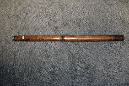 A vintage Australian Aboriginal hollowed eucalyptus wood Didgeridoo, featuring traditional hand