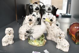 Four 20th-century Royal Doulton Wally dogs; sold with a larger pair of Staffordshire-style