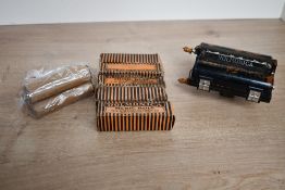 An early 20th-century German Rolmonica black bakelite harmonica; sold along with a selection of