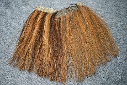 Ethnographic interest* a Papua New Guinea ceremonial grass skirt, with broad woven band, 62cm