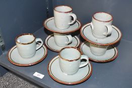 A small quantity of vintage Highland 'Bootland' Stoneware cups and saucers, having a teal and