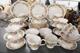 A quantity of 20th-century Colclough bone china floral tablewares, featuring pink rose detailing