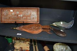 A late 19th-century pair of decorative oak fire bellows, featuring an intricately carved floral